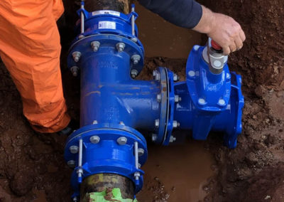 New branch connecting to an existing fire main with a sluice valve to isolate new branch at a school in Salisbury